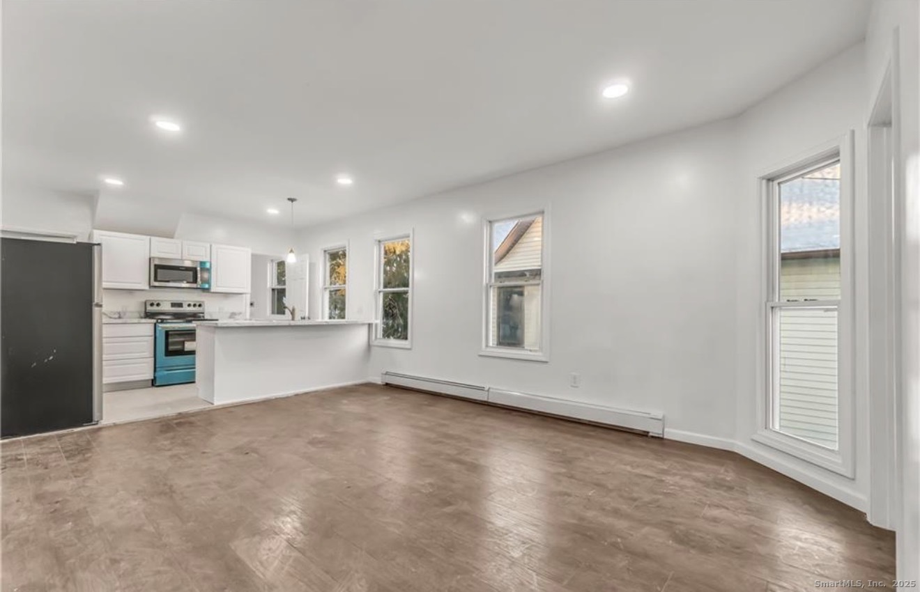 74 Carleton Avenue Bridgeport, CT 06604 - Photo 7 of 15 a view of kitchen with furniture and refrigerator