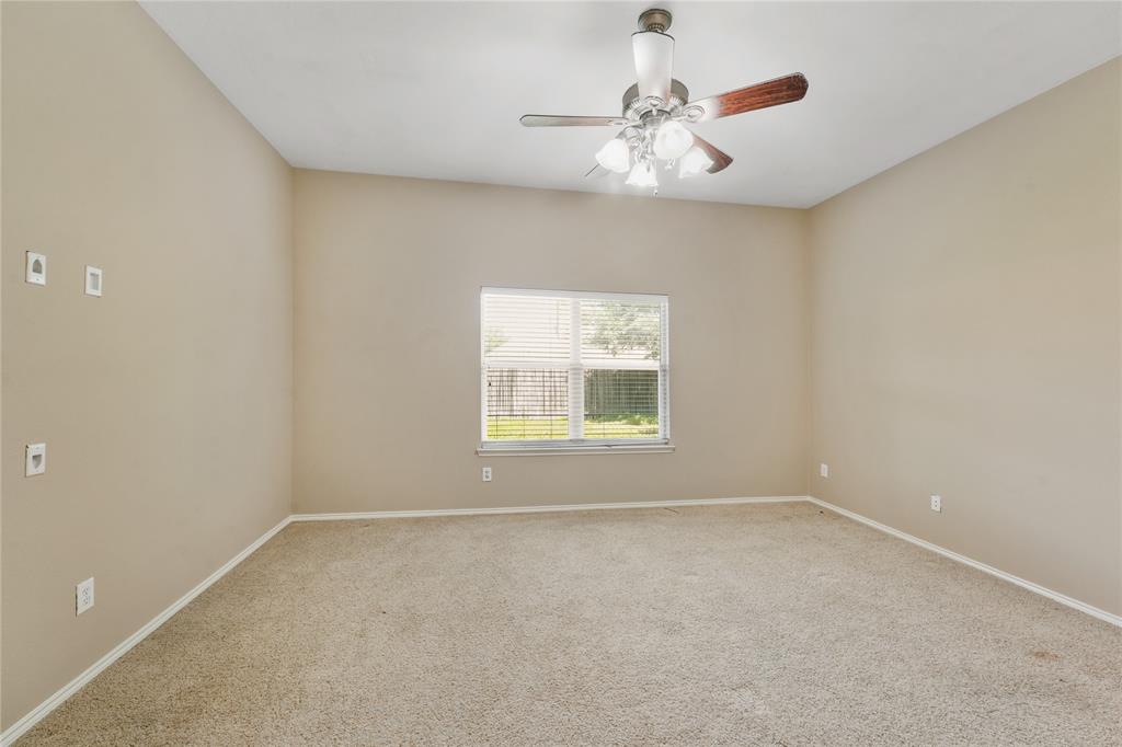 2003 Diamondback Forney, TX 75126 - Photo 27 of 30 Empty room with ceiling fan and carpet
