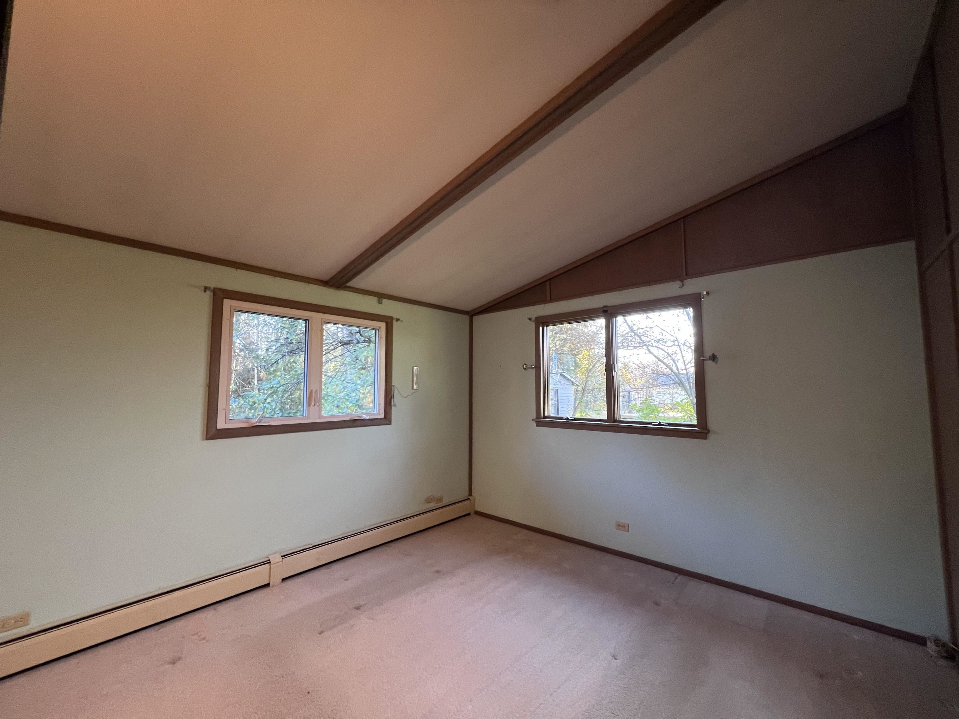 202 North 58th Street Superior, WI 54880 - Photo 15 of 30 Carpeted empty room with a baseboard heating unit and baseboards