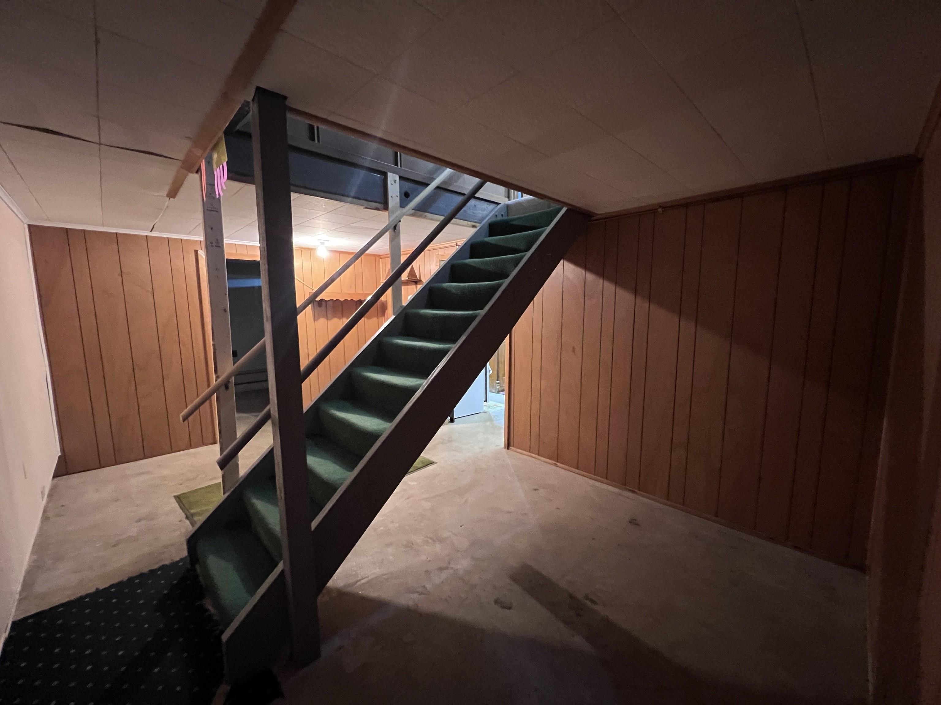 202 North 58th Street Superior, WI 54880 - Photo 19 of 30 Finished below grade area featuring stairs and wood walls