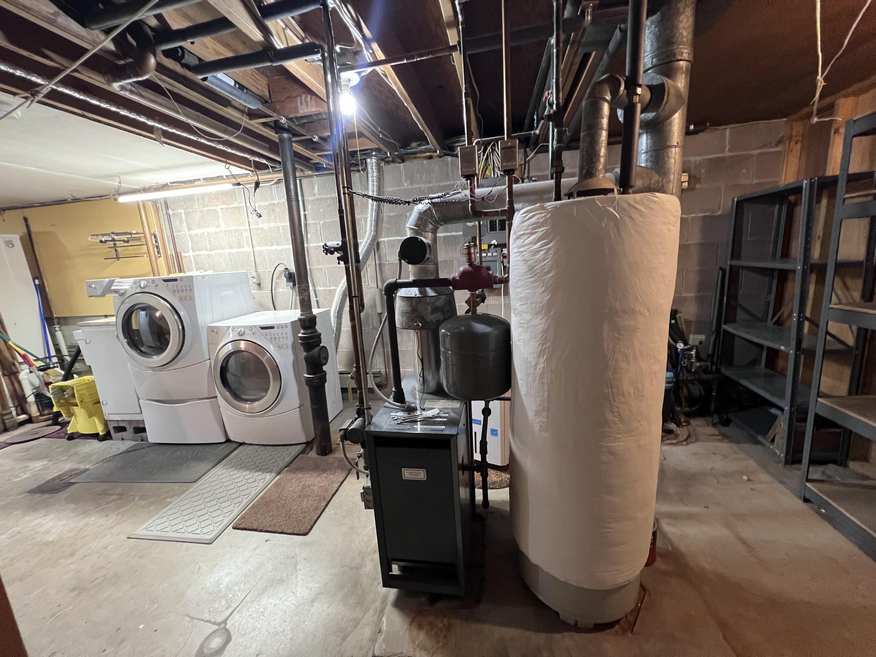202 North 58th Street Superior, WI 54880 - Photo 22 of 30 Unfinished below grade area with water heater and independent washer and dryer