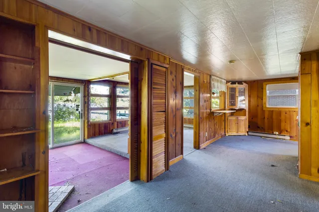 a view of an empty room and a window