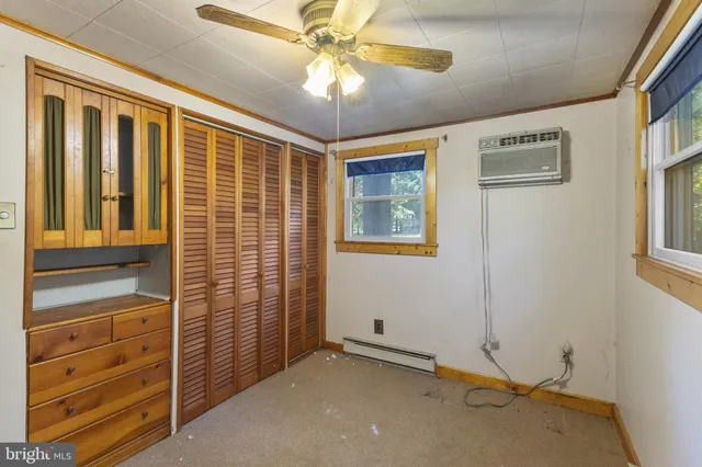 a view of an empty room with a window