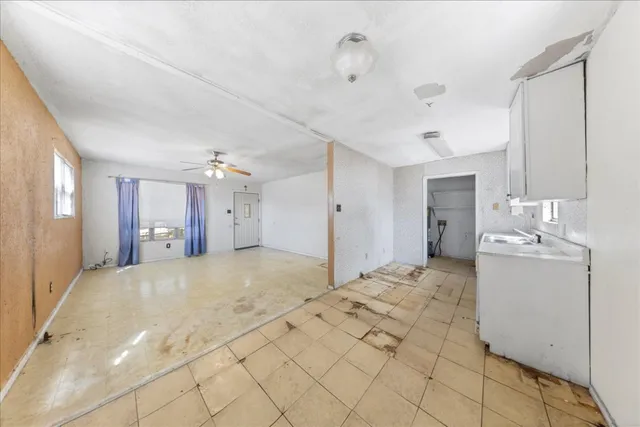 a large bathroom with a sink vanity and a mirror