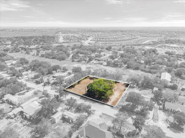 an aerial view of beach and residential space