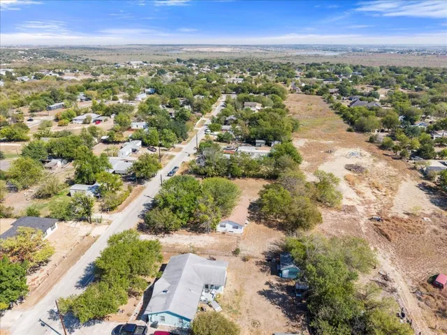 an aerial view of city and lake