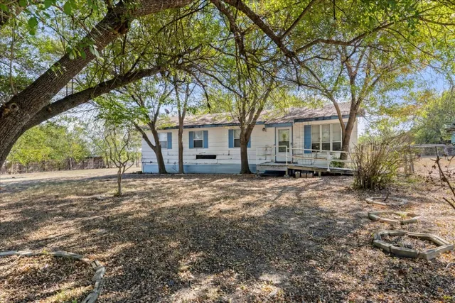 a house with trees in front of it