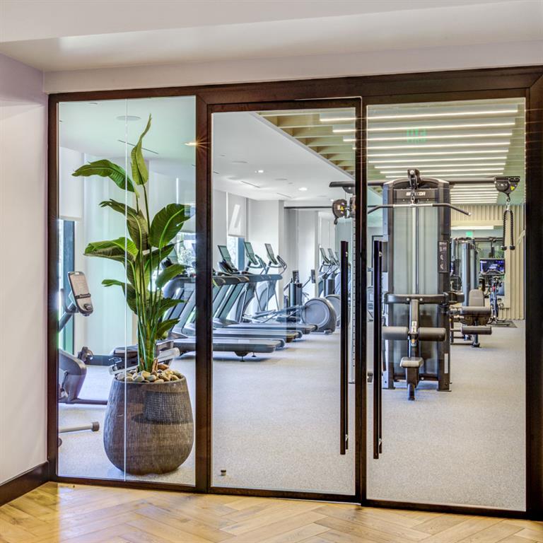2425 Peachtree Street Northeast, Unit 1505 Atlanta, GA 30305 - Photo 14 of 25 a view of living room kitchen with furniture and potted plant
