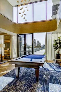 a view of a patio with a table and chairs