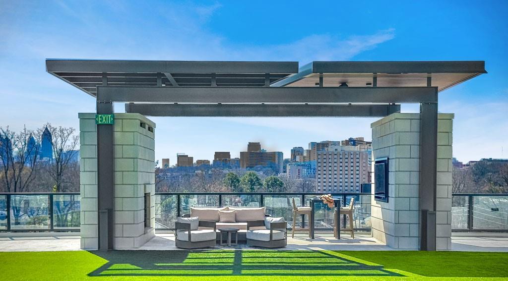 2425 Peachtree Street Northeast, Unit 1505 Atlanta, GA 30305 - Photo 23 of 25 a front view of a house with a yard table and chairs