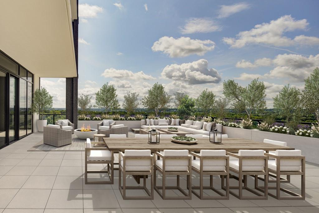 2425 Peachtree Street Northeast, Unit 1505 Atlanta, GA 30305 - Photo 3 of 25 a view of a patio with dining table and chairs