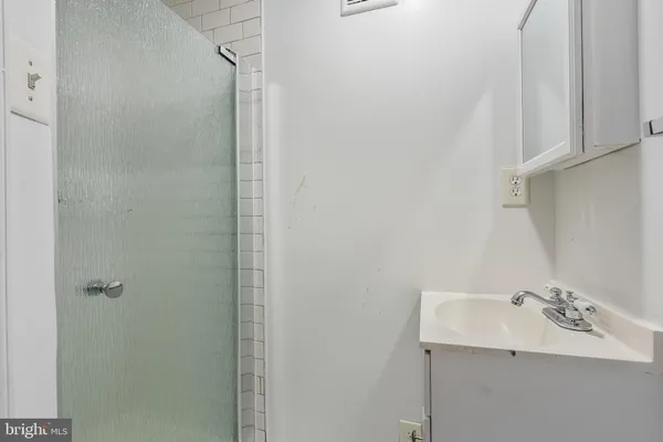 a bathroom with a sink and mirror