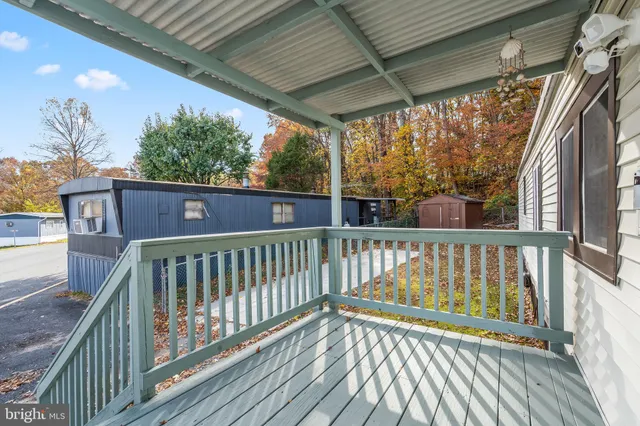 a view of balcony with wooden floor