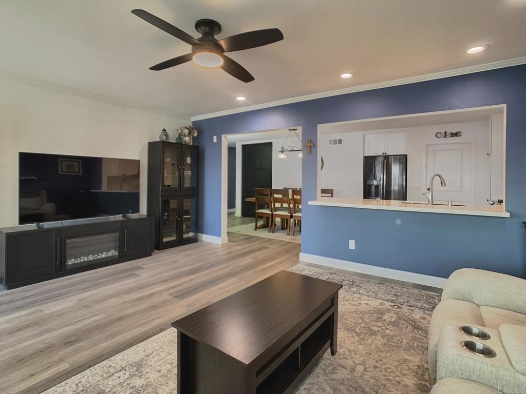 10005 3 Oaks Way Santee, CA 92071 - Photo 11 of 25 a living room with furniture and a flat screen tv