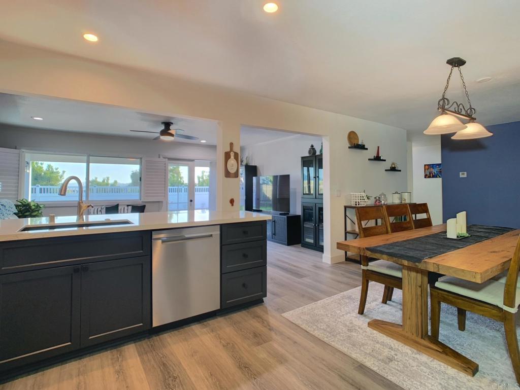 10005 3 Oaks Way Santee, CA 92071 - Photo 8 of 25 a kitchen with stainless steel appliances granite countertop a kitchen island a stove and a sink