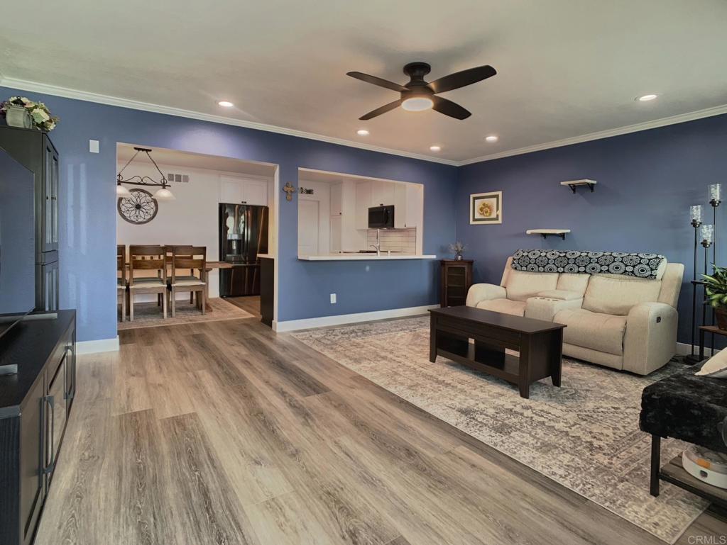 10005 3 Oaks Way Santee, CA 92071 - Photo 10 of 25 a living room with furniture and a wooden floor