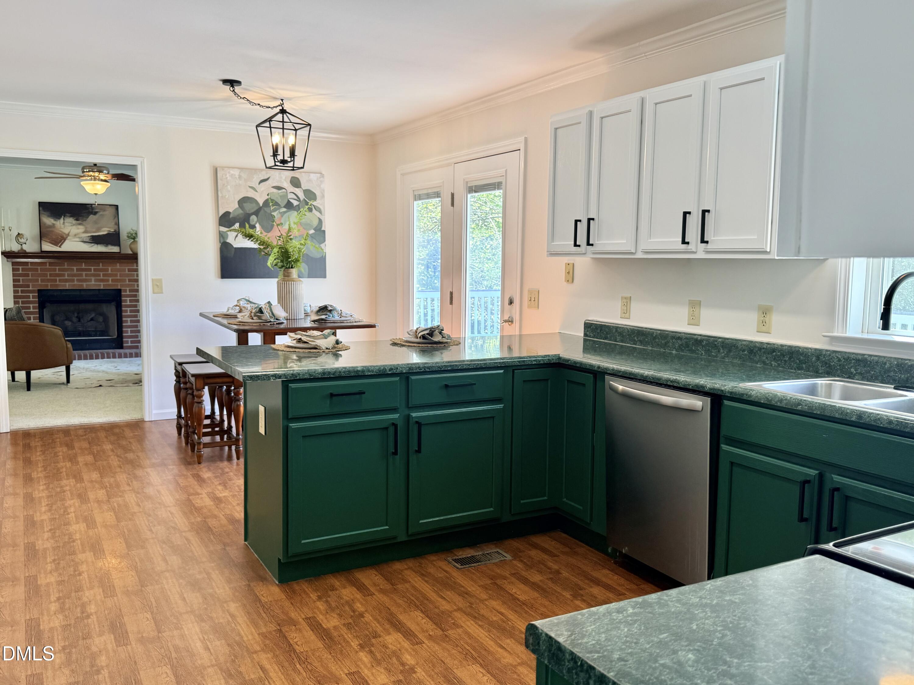 2429 Halifax Road Roxboro, NC 27573 - Photo 22 of 54 a kitchen with stainless steel appliances granite countertop a sink and cabinets