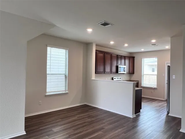 a view of kitchen with wooden floor and electronic window