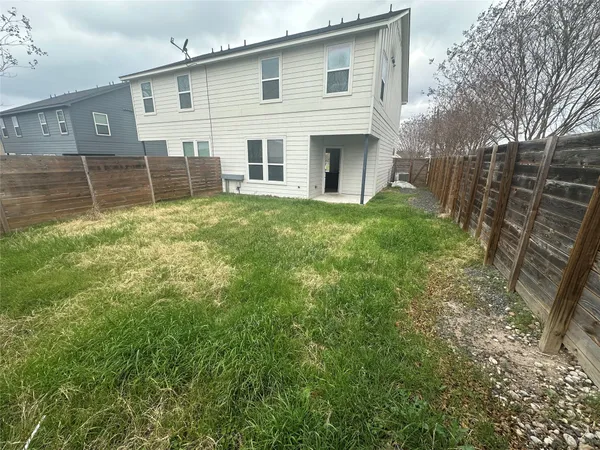 a view of backyard with green space