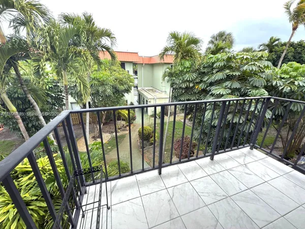 a view of balcony with small garden