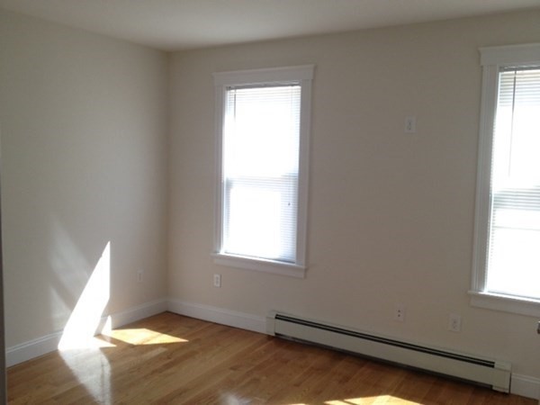 200 Brooks Street, Unit 1 Boston, MA 02128 - Photo 5 of 10 a view of an empty room and window
