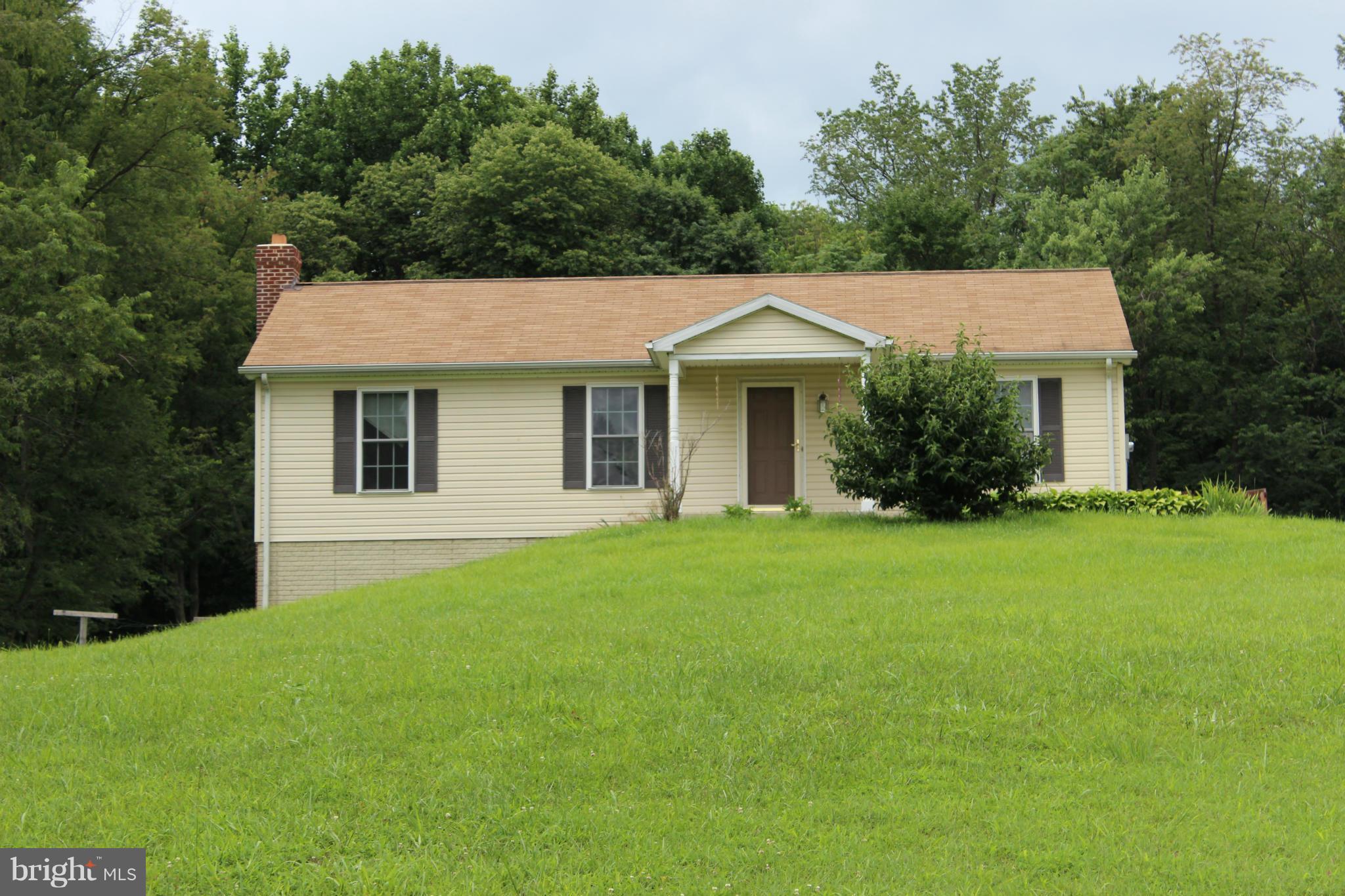 2880 Basford Road Frederick, MD 21703 - Photo 1 of 17 a front view of a house with a garden
