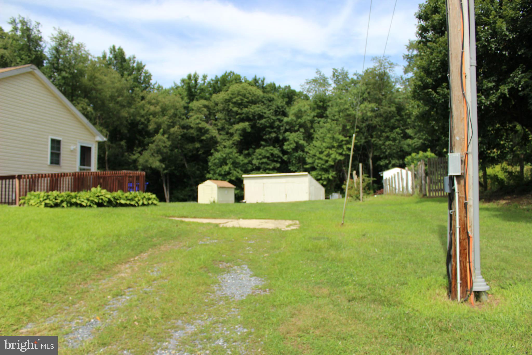 2880 Basford Road Frederick, MD 21703 - Photo 13 of 17 a view of a garden with a house in the background