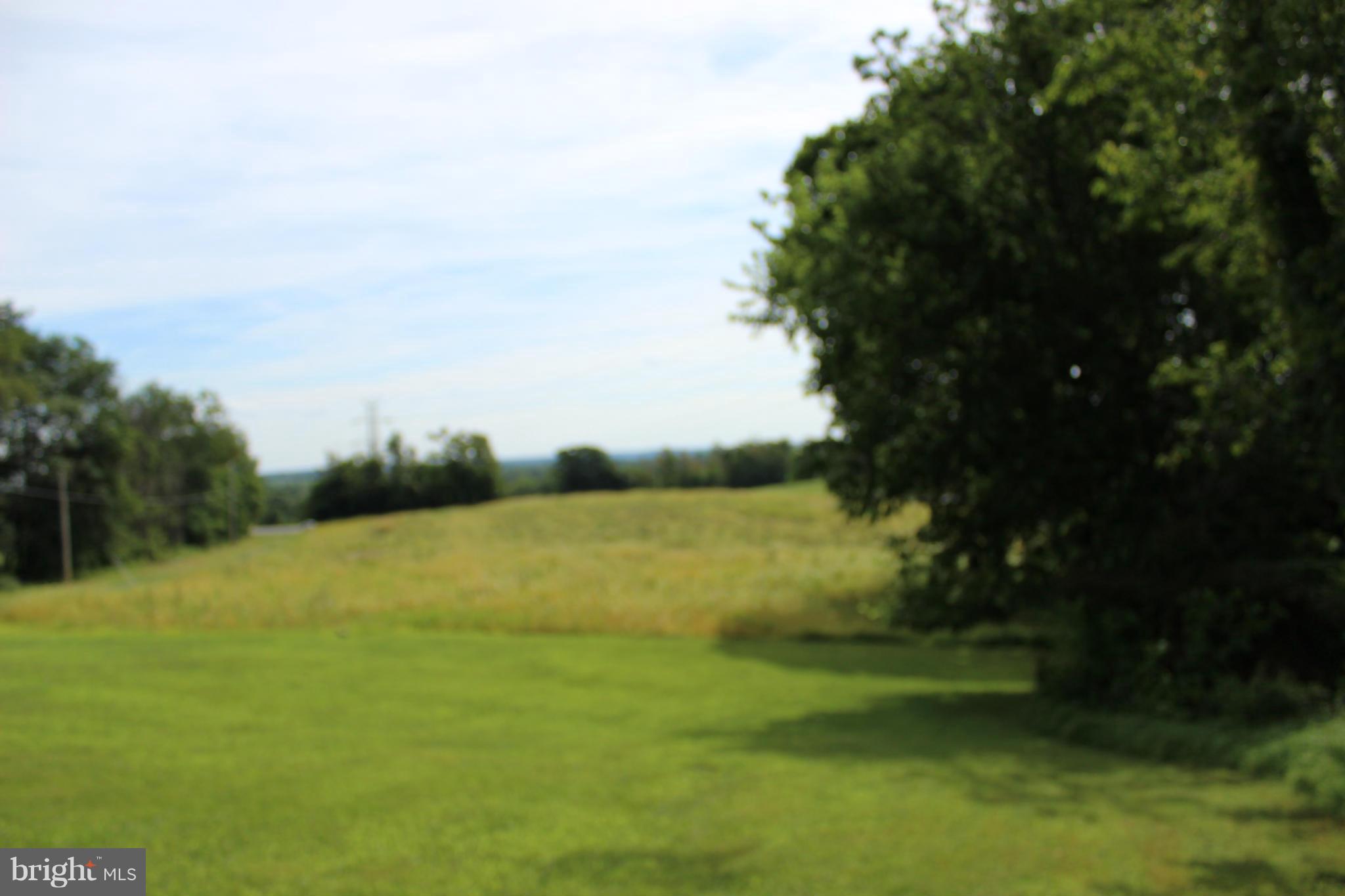 2880 Basford Road Frederick, MD 21703 - Photo 7 of 17 a view of a lake with a yard
