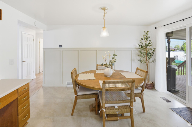 5108 South 2000th Street West Roy, UT 84067 - Photo 12 of 61 Dining room with a decorative wall and a wainscoted wall