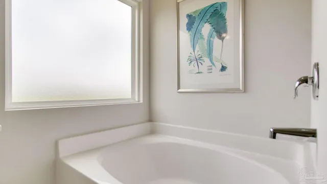 a en suite bathroom with 2 sink and a mirror