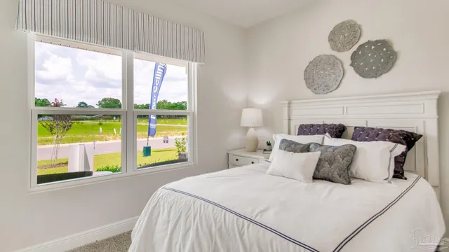 a bedroom with a bed and cabinets