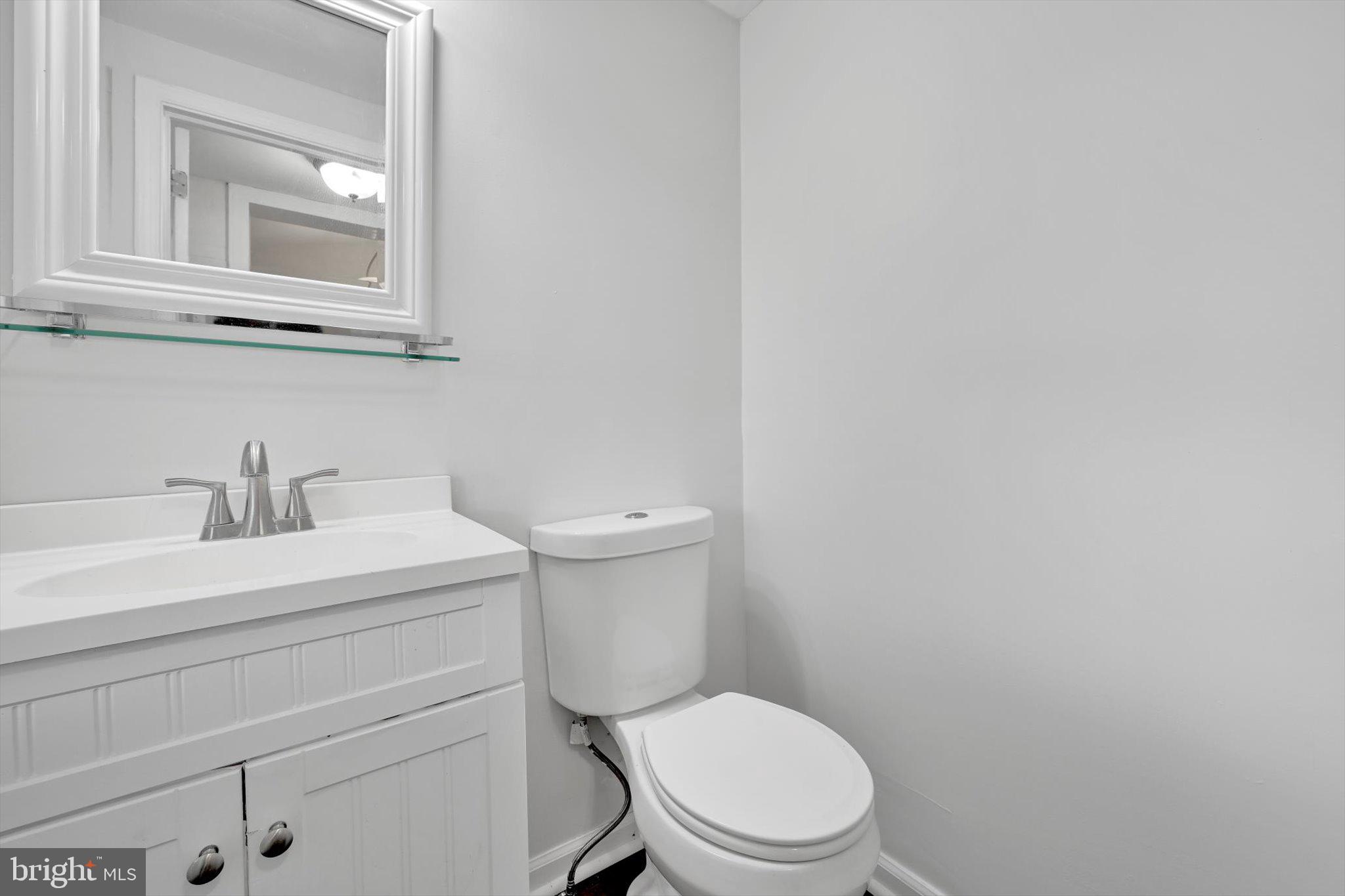 3964 Penn Avenue Sinking Spring, PA 19608 - Photo 15 of 30 a white toilet sitting next to a bathroom sink