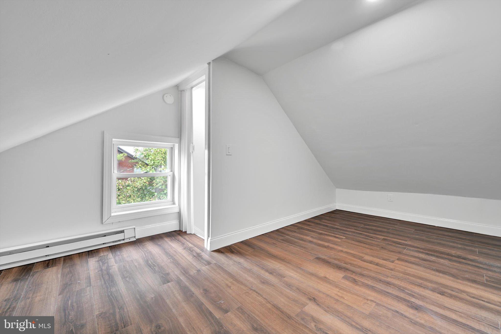 3964 Penn Avenue Sinking Spring, PA 19608 - Photo 25 of 30 an empty room with wooden floor and windows