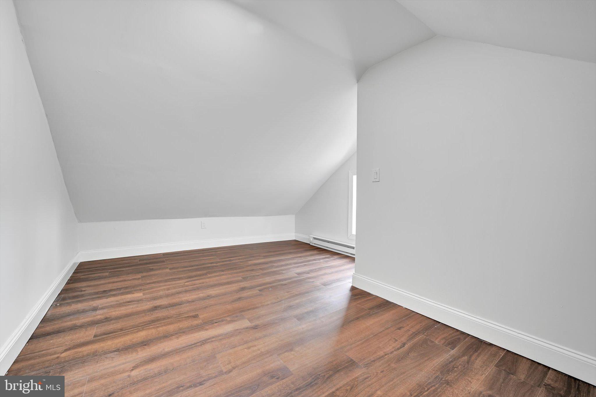 3964 Penn Avenue Sinking Spring, PA 19608 - Photo 26 of 30 a view of an empty room with wooden floor
