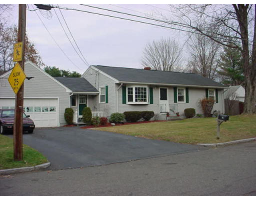 34 Navajo Road Springfield, MA 01109 - Photo 1 of 1 a front view of a house with a yard and garage
