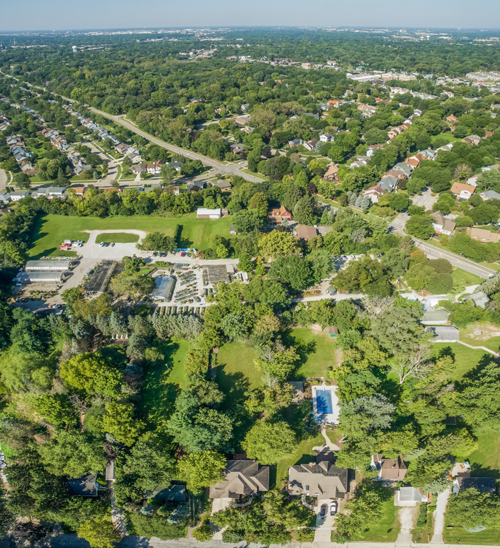 1139 Tuthill Road Naperville, IL 60563 - Photo 4 of 53 an aerial view of residential houses with outdoor space and trees
