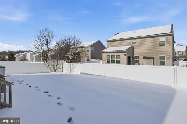 a view of house with yard