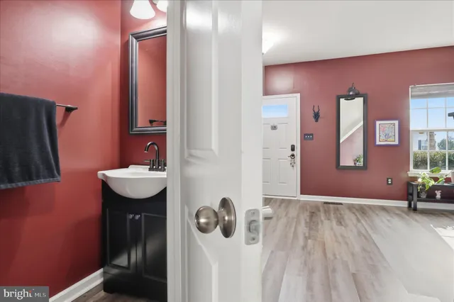 a bathroom with a sink and mirror