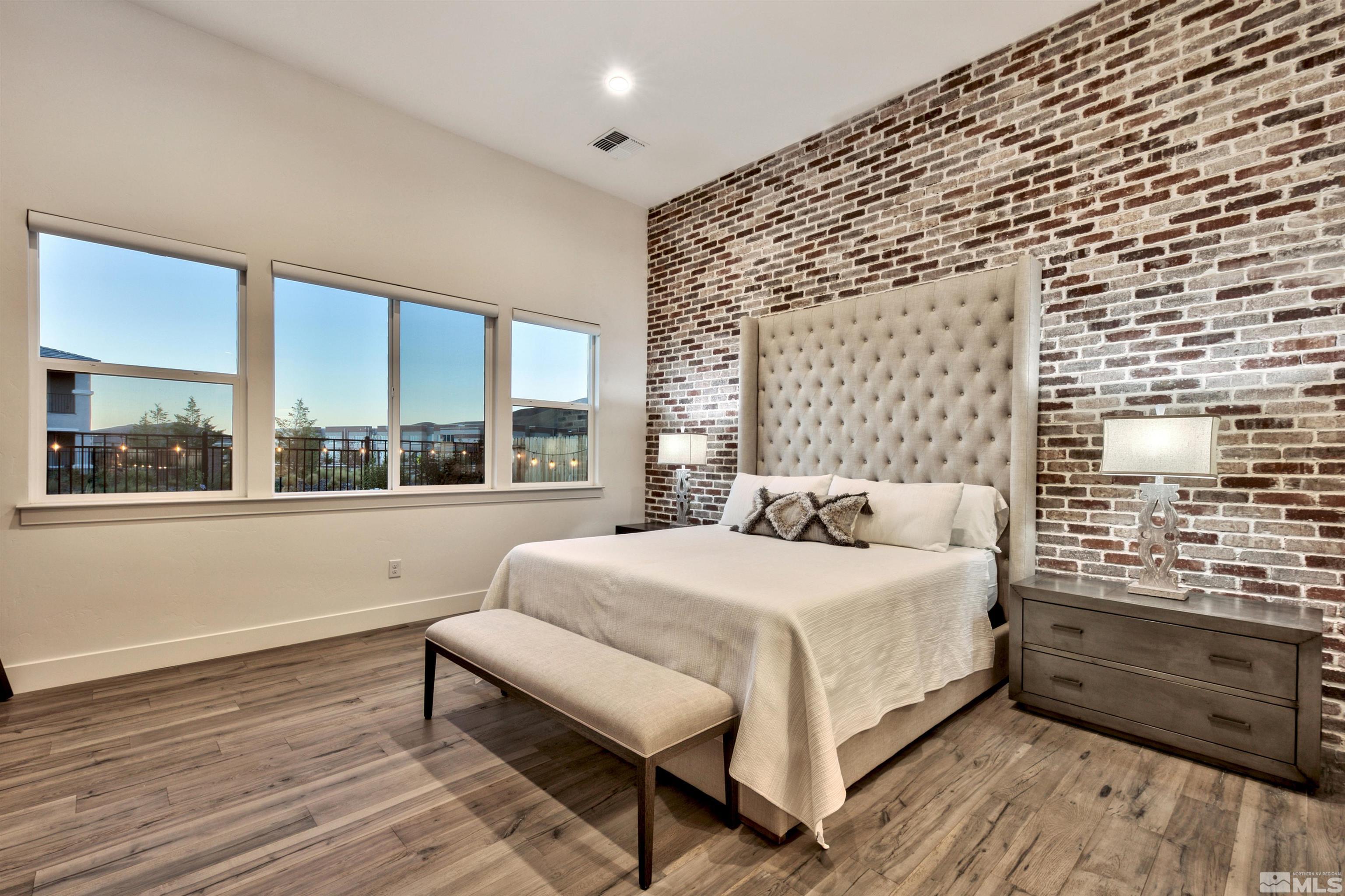 2385 Buttermere Drive Reno, NV 89521 - Photo 12 of 40 a bedroom with a bed and a large window