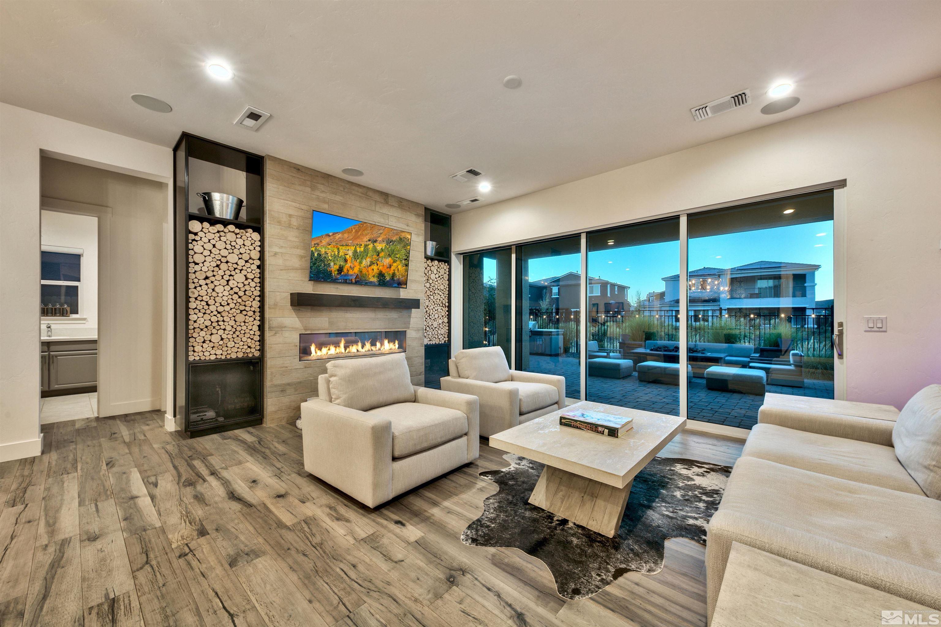 2385 Buttermere Drive Reno, NV 89521 - Photo 9 of 40 a living room with furniture fireplace and flat screen tv