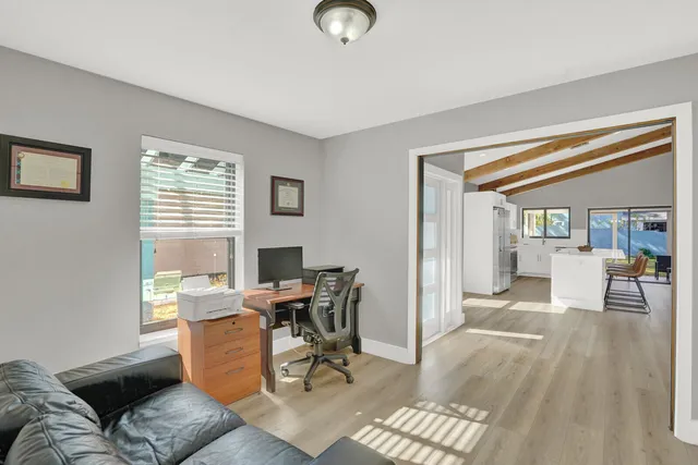 a workspace with furniture and a window