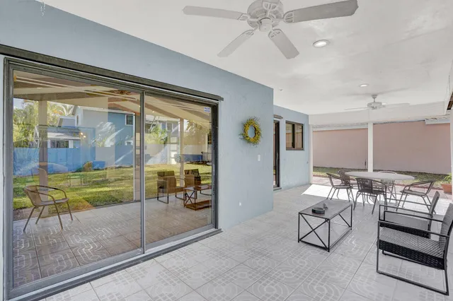 a room with lots of table and chairs