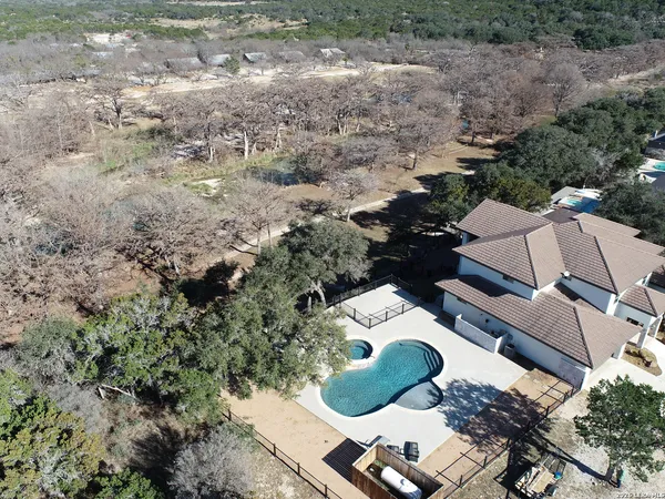 an aerial view of house with yard