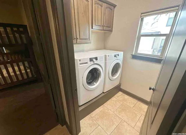 a room with furniture and a large window