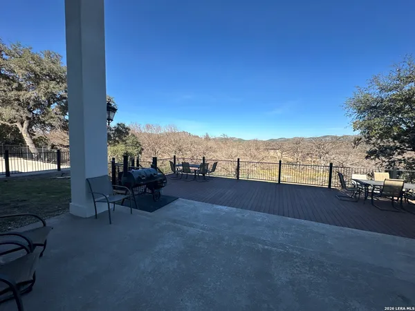 a view of terrace with wooden floor and lake view