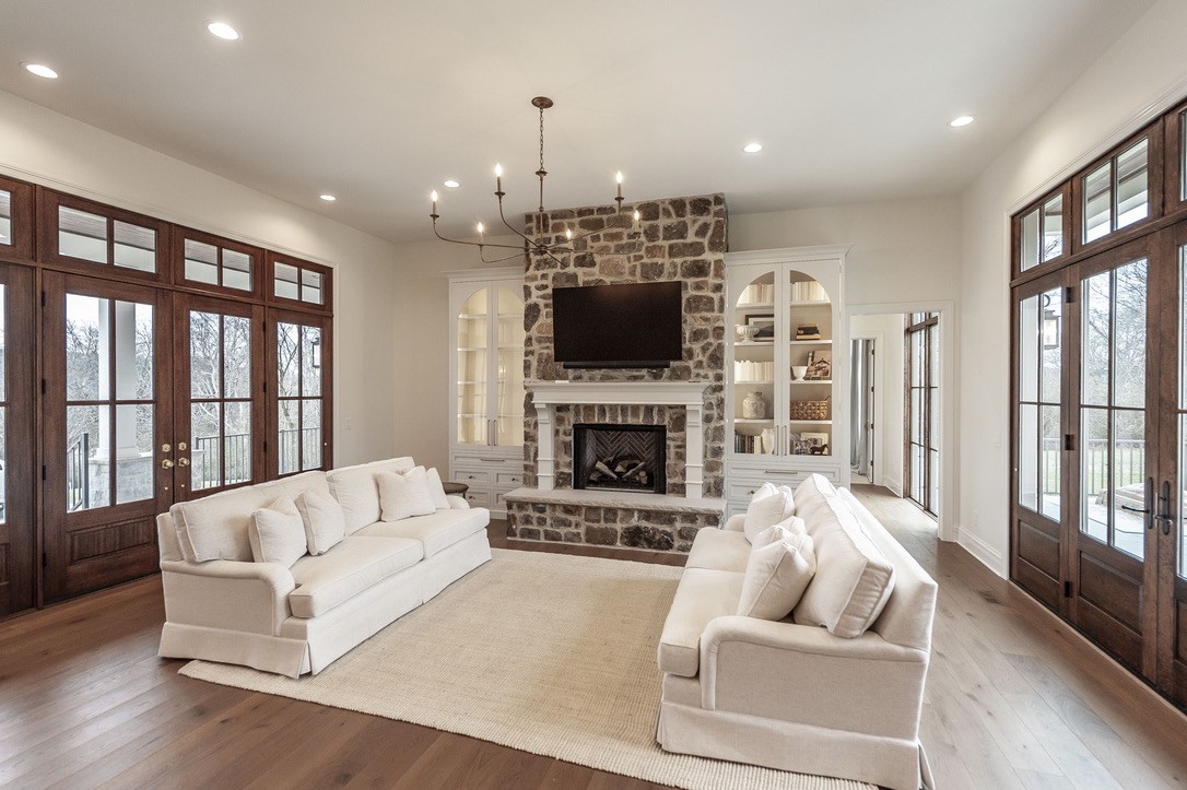 197 E Bugg Hollow Road Cottontown, TN 37048 - Photo 11 of 61 a living room with furniture a flat screen tv and a fireplace
