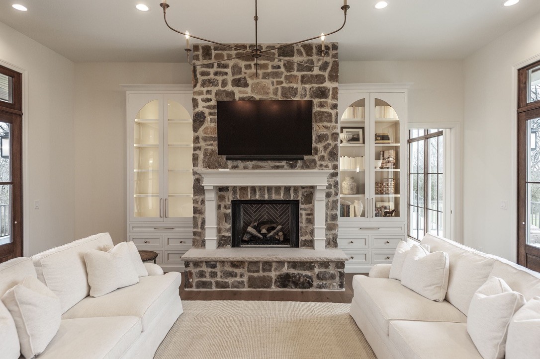 197 E Bugg Hollow Road Cottontown, TN 37048 - Photo 12 of 61 a living room with furniture a flat screen tv and a fireplace