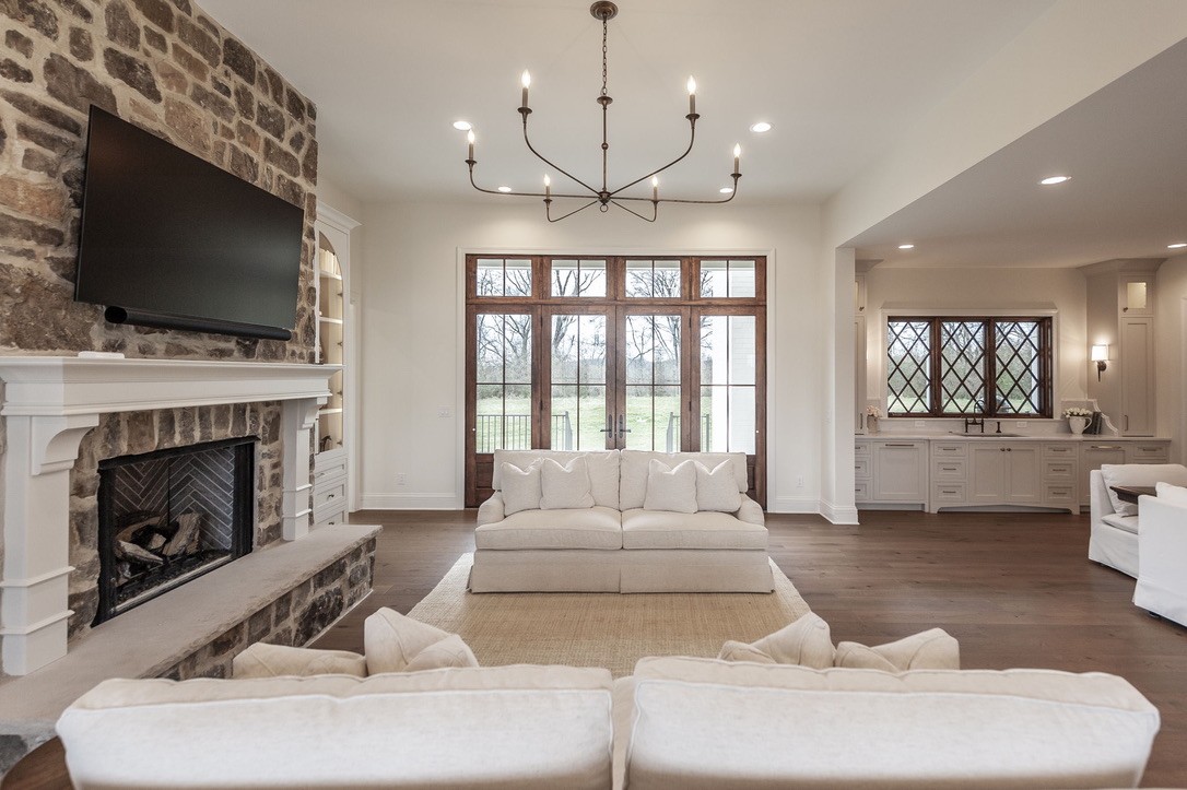 197 E Bugg Hollow Road Cottontown, TN 37048 - Photo 14 of 61 a living room with furniture a flat screen tv and a fireplace