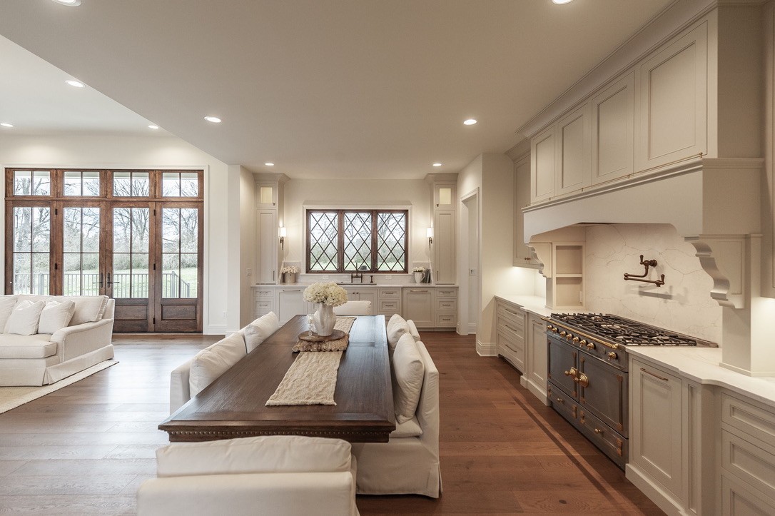 197 E Bugg Hollow Road Cottontown, TN 37048 - Photo 15 of 61 a large kitchen with kitchen island a large window a sink and stainless steel appliances