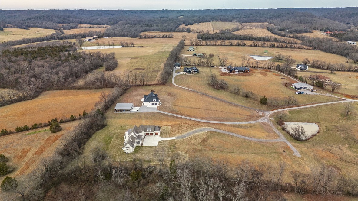 197 E Bugg Hollow Road Cottontown, TN 37048 - Photo 2 of 61 an aerial view of residential houses with outdoor space